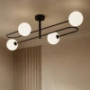 Czarna lampa sufitowa z czterema białymi kulami SILA Kaja Lighting K-5991