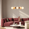 Lampa wisząca podłużna z elementami ceramiki i białymi kloszami FLORES 20W LED 3000K Candellux Studio 33-50687